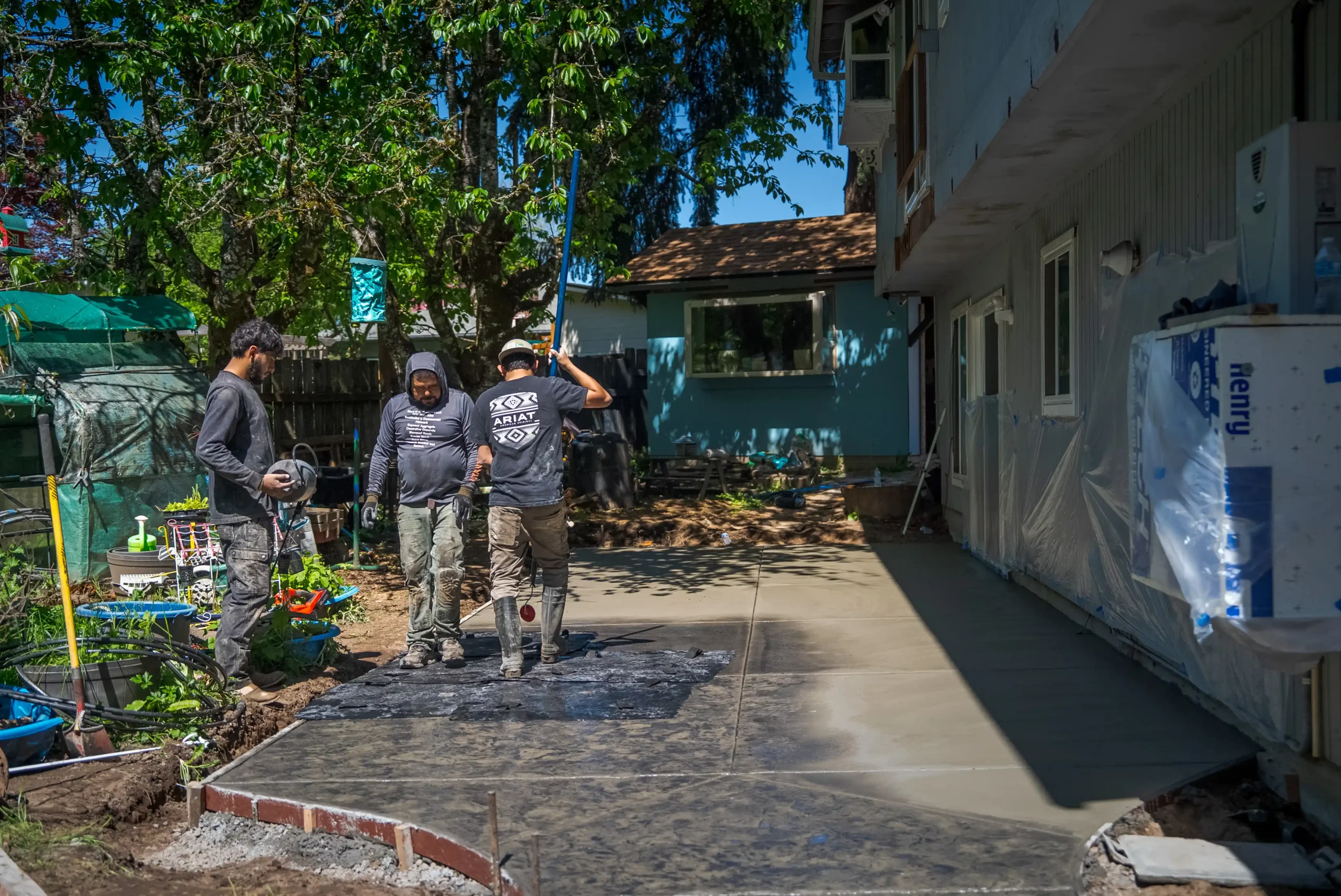 Clark Exteriors crew installing a new hardscape walkway