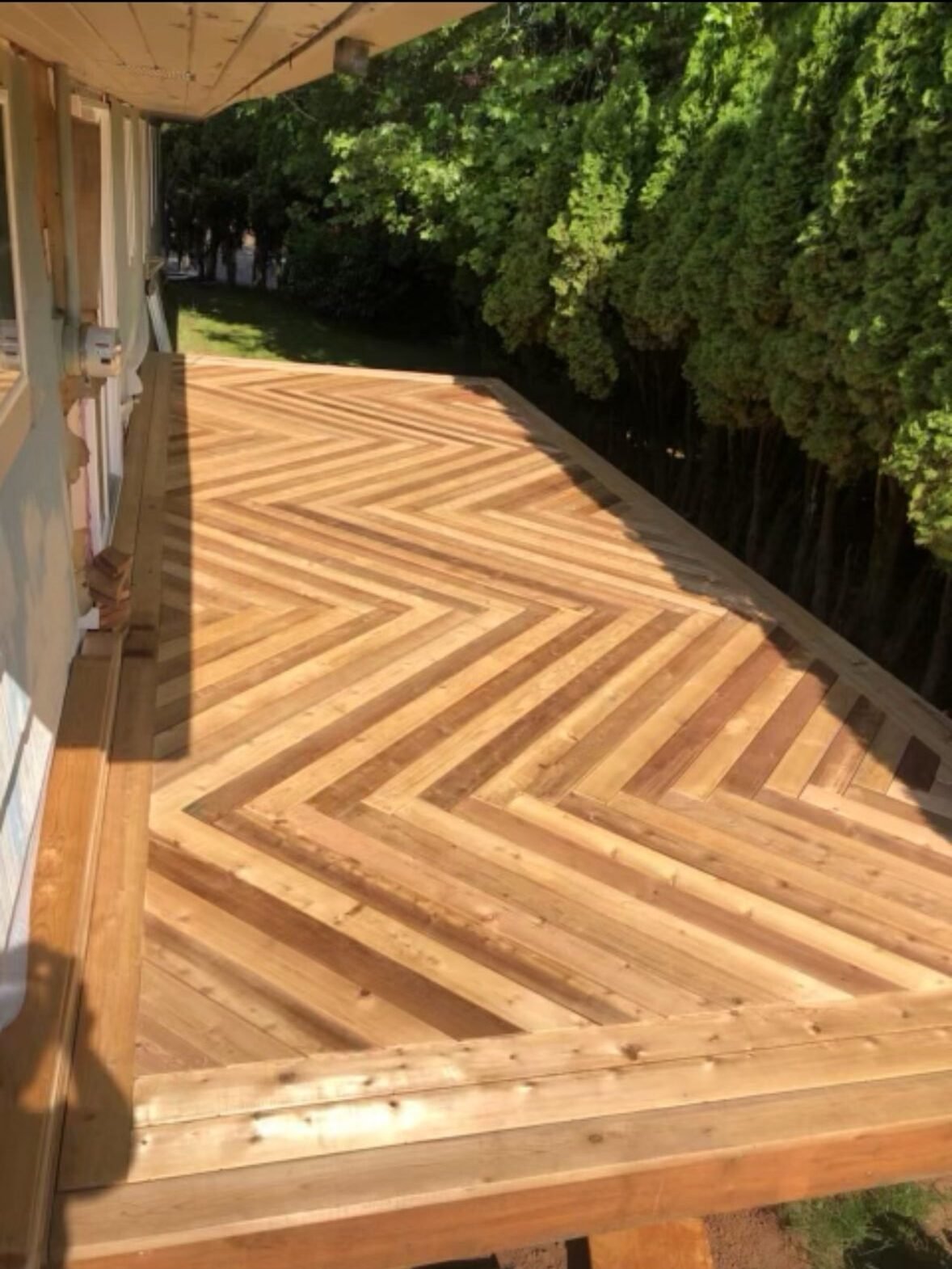 Herringbone-pattern wood deck under construction at a Western Oregon home